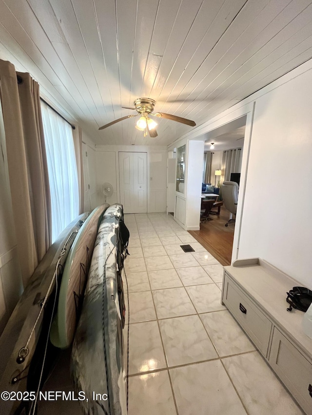 5000 Elm St, Welaka, FL 32189 - living area with a ceiling fan, light tile patterned floors, and wood ceiling