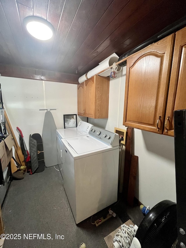 5000 Elm St, Welaka, FL 32189 - washroom featuring cabinet space and separate washer and dryer