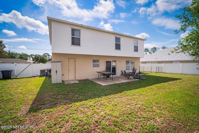 12 Roxland Ln, Palm Coast, FL 32164 - back of house featuring a patio area, central AC unit, stucco siding, and a gate