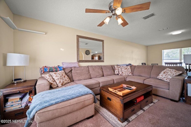 12 Roxland Ln, Palm Coast, FL 32164 - carpeted living room with a textured ceiling and a ceiling fan