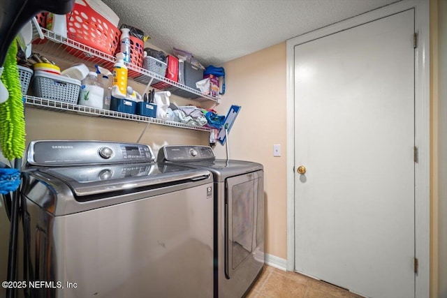 12 Roxland Ln, Palm Coast, FL 32164 - laundry room featuring independent washer and dryer, a textured ceiling, and baseboards