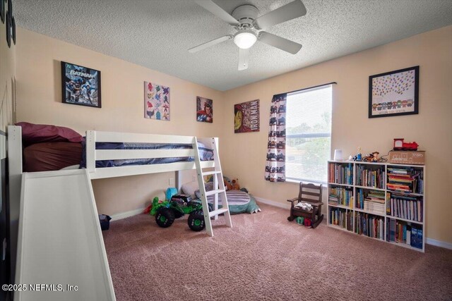 12 Roxland Ln, Palm Coast, FL 32164 - carpeted bedroom with a textured ceiling, baseboards, and a ceiling fan