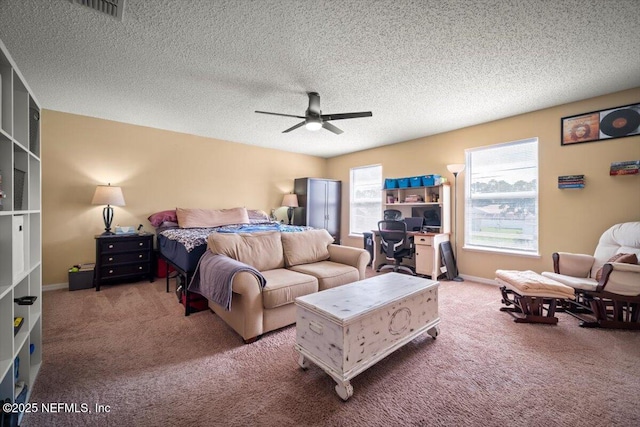 12 Roxland Ln, Palm Coast, FL 32164 - carpeted bedroom with a ceiling fan and a textured ceiling