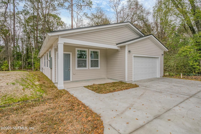 11807 Lem Turner Rd, Jacksonville, FL 32218 - view of front of home featuring an attached garage and concrete driveway