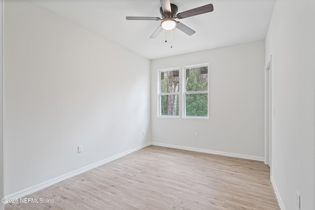 11807 Lem Turner Rd, Jacksonville, FL 32218 - unfurnished room with light wood-style floors, ceiling fan, and baseboards