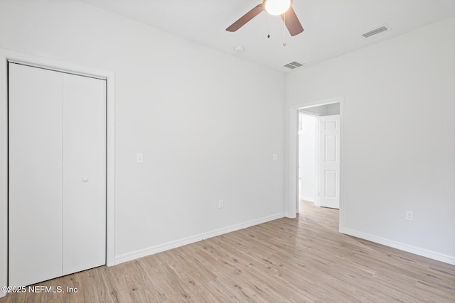 11807 Lem Turner Rd, Jacksonville, FL 32218 - unfurnished bedroom featuring light wood-style floors, baseboards, a closet, and a ceiling fan