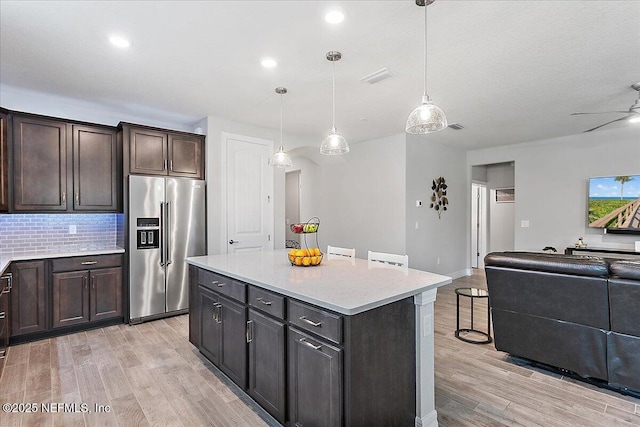 52 Bent Lake Ct, Saint Augustine, FL 32095 - kitchen with high quality fridge, open floor plan, light wood-style flooring, light countertops, and tasteful backsplash