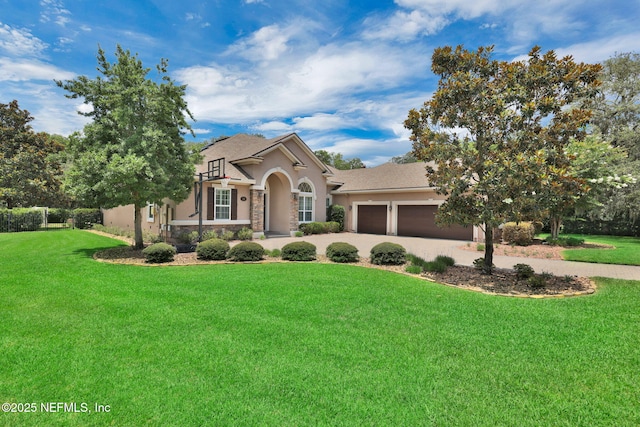 104 Hickory Hill Dr, Saint Augustine, FL 32095 - view of front of house featuring stucco siding, a garage, a front lawn, and stone siding