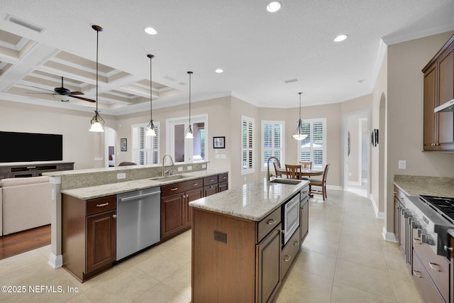 104 Hickory Hill Dr, Saint Augustine, FL 32095 - kitchen with stainless steel appliances, open floor plan, a center island with sink, a ceiling fan, and beam ceiling