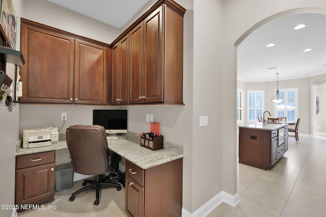 104 Hickory Hill Dr, Saint Augustine, FL 32095 - office area featuring built in desk, arched walkways, recessed lighting, and light tile patterned floors