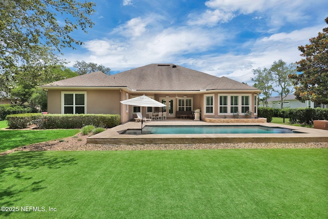 104 Hickory Hill Dr, Saint Augustine, FL 32095 - rear view of house featuring a lawn, a patio area, stucco siding, and roof with shingles