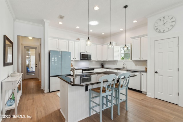1743 Azalea St, Fernandina Beach, FL 32034 - kitchen featuring white appliances, a sink, dark countertops, white cabinetry, and crown molding