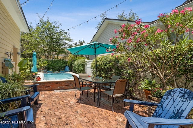 1743 Azalea St, Fernandina Beach, FL 32034 - view of patio with an outdoor hot tub and outdoor dining area