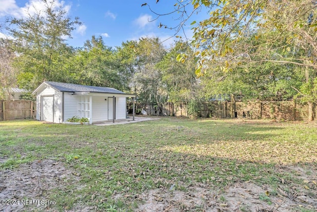 1821 Wofford Ave, Jacksonville, FL 32218 - view of yard featuring an outbuilding and a patio