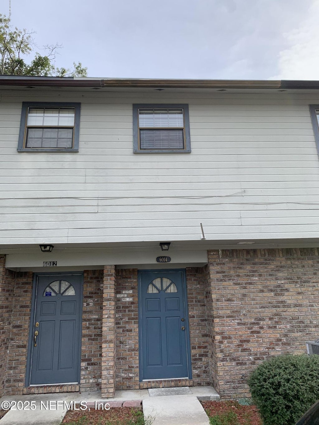 6014 Du-Clay Rd, Jacksonville, FL 32244 - view of front of property featuring brick siding