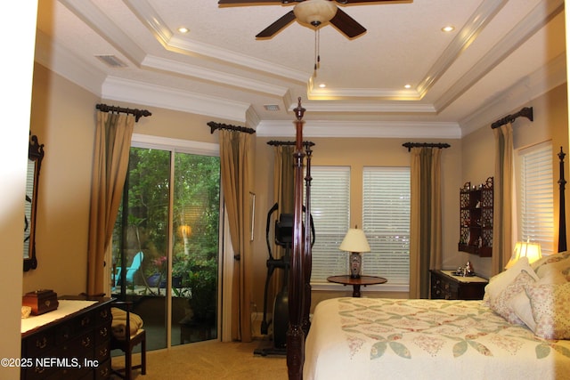 204 Stonewell Dr, Saint Johns, FL 32259 - carpeted bedroom featuring a tray ceiling, ornamental molding, and a ceiling fan