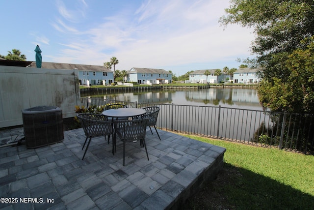 58 Islander Cir, Saint Augustine, FL 32080 - view of patio / terrace featuring cooling unit, a water view, outdoor dining area, and a residential view