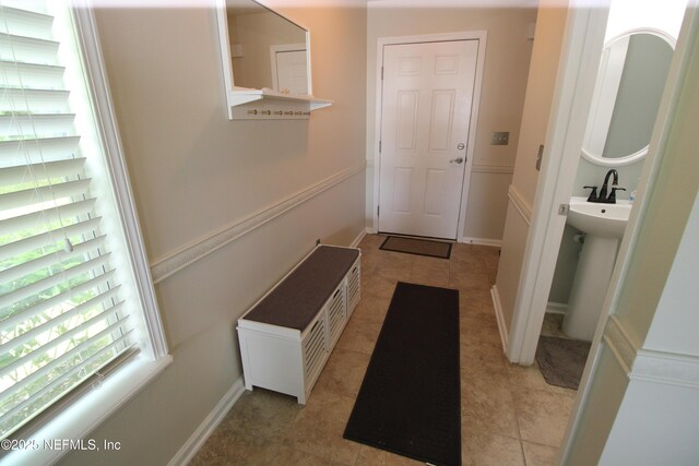 58 Islander Cir, Saint Augustine, FL 32080 - mudroom featuring baseboards and a sink