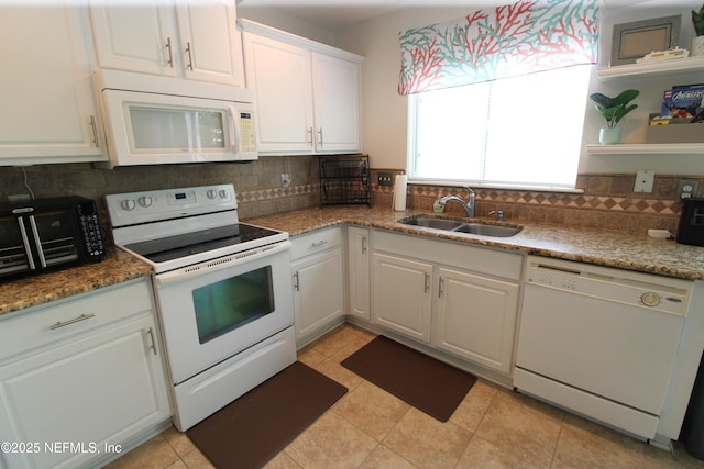 58 Islander Cir, Saint Augustine, FL 32080 - kitchen with white appliances, a sink, decorative backsplash, white cabinetry, and open shelves
