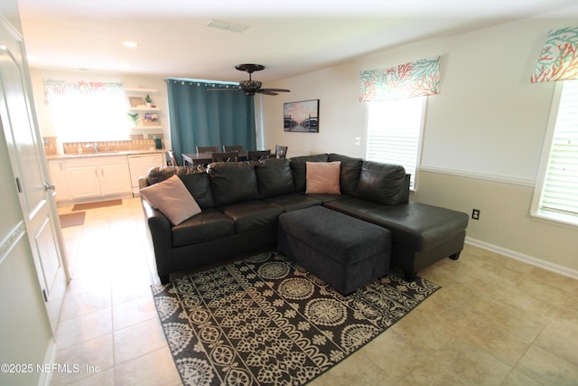 58 Islander Cir, Saint Augustine, FL 32080 - living area featuring a ceiling fan, light tile patterned flooring, and baseboards