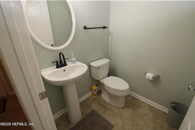 58 Islander Cir, Saint Augustine, FL 32080 - half bathroom featuring toilet, baseboards, and tile patterned floors