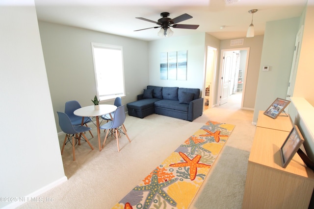 58 Islander Cir, Saint Augustine, FL 32080 - living area with light carpet, baseboards, and a ceiling fan