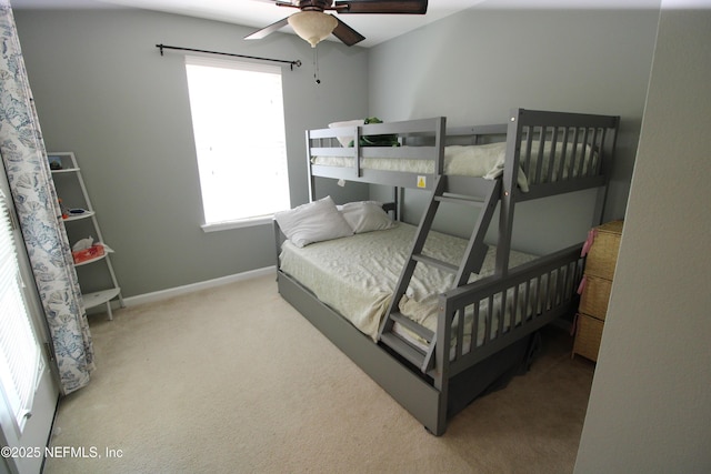 58 Islander Cir, Saint Augustine, FL 32080 - carpeted bedroom featuring multiple windows, baseboards, and a ceiling fan