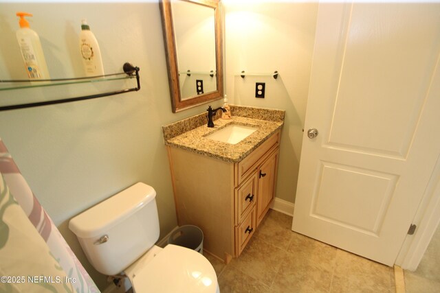 58 Islander Cir, Saint Augustine, FL 32080 - bathroom with vanity, toilet, and tile patterned floors