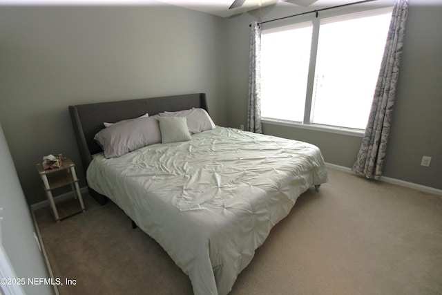 58 Islander Cir, Saint Augustine, FL 32080 - bedroom with light colored carpet, baseboards, and ceiling fan