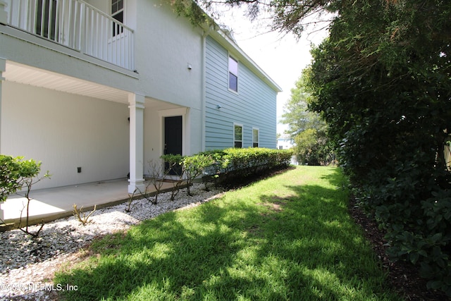 58 Islander Cir, Saint Augustine, FL 32080 - view of grassy yard with a patio area