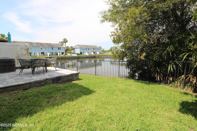 58 Islander Cir, Saint Augustine, FL 32080 - view of yard featuring central air condition unit, a water view, a patio, and a residential view