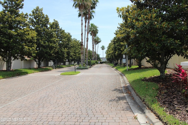 58 Islander Cir, Saint Augustine, FL 32080 - view of street with curbs, a gate, and a gated entry