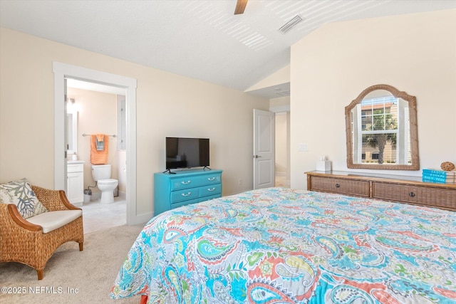 125 5th St, Saint Augustine, FL 32080 - carpeted bedroom featuring lofted ceiling, ensuite bath, and a ceiling fan