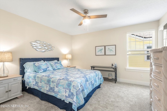 125 5th St, Saint Augustine, FL 32080 - bedroom with light colored carpet, baseboards, and a ceiling fan