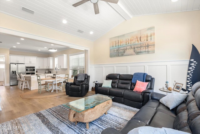 125 5th St, Saint Augustine, FL 32080 - living area featuring light wood-type flooring, ceiling fan, recessed lighting, a decorative wall, and a wainscoted wall