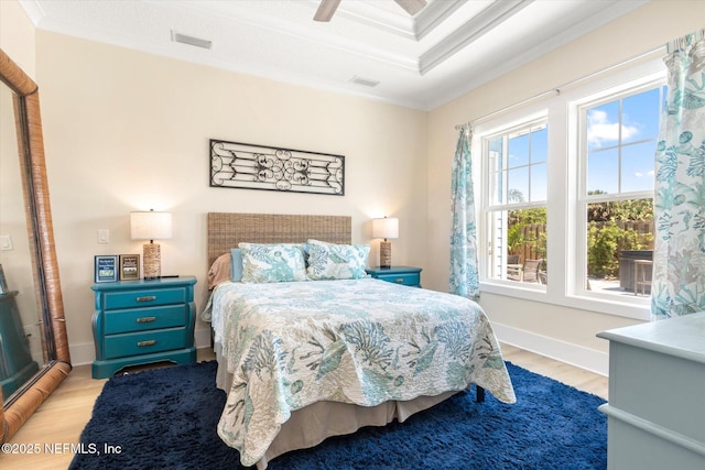 125 5th St, Saint Augustine, FL 32080 - bedroom featuring ornamental molding, light wood-style floors, and a ceiling fan