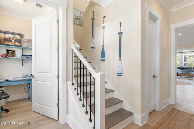 125 5th St, Saint Augustine, FL 32080 - stairway with wood finished floors, baseboards, and recessed lighting