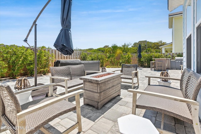 125 5th St, Saint Augustine, FL 32080 - fenced backyard with a patio area, an outdoor living space with a fire pit, and grilling area