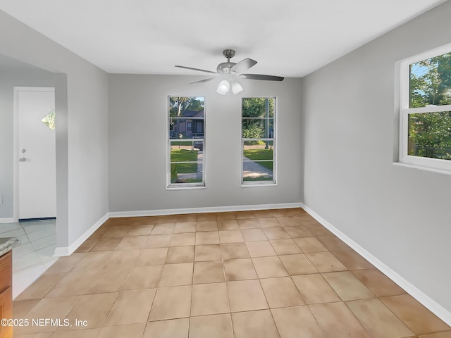 2926 Hunt St, Jacksonville, FL 32254 - empty room featuring ceiling fan, light tile patterned floors, and baseboards
