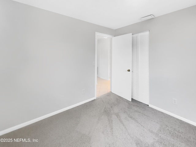 2926 Hunt St, Jacksonville, FL 32254 - unfurnished bedroom with carpet floors, a closet, and baseboards