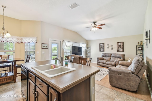 104 Twin Lakes Dr, Saint Augustine, FL 32084 - kitchen with a sink, vaulted ceiling, a chandelier, ceiling fan, and open floor plan