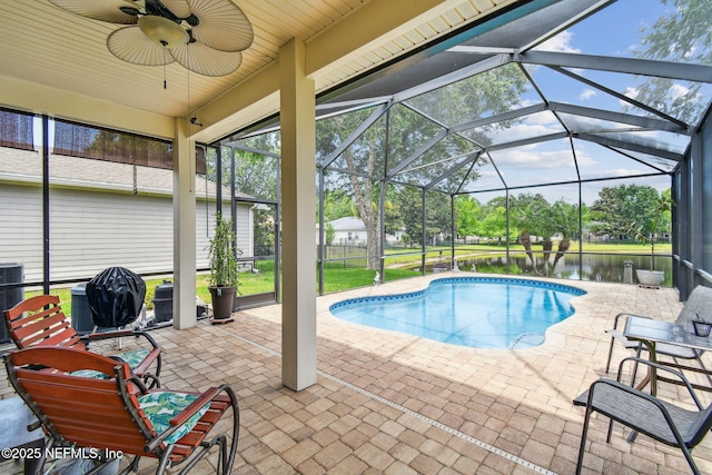 104 Twin Lakes Dr, Saint Augustine, FL 32084 - outdoor pool featuring a patio, ceiling fan, and glass enclosure