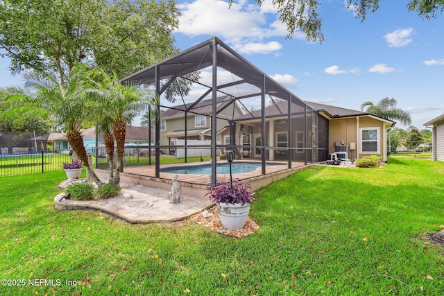 104 Twin Lakes Dr, Saint Augustine, FL 32084 - back of house featuring glass enclosure and a patio area