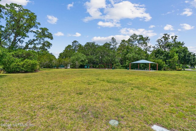 104 Twin Lakes Dr, Saint Augustine, FL 32084 - view of grassy yard featuring a gazebo and a carport