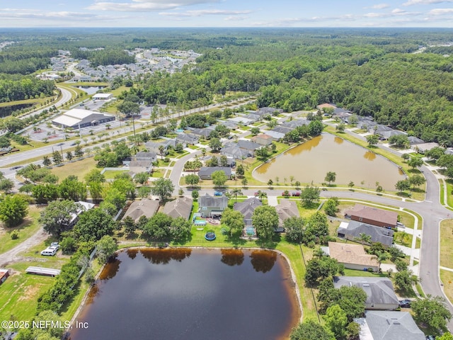 104 Twin Lakes Dr, Saint Augustine, FL 32084 - aerial perspective of suburban area featuring a heavily wooded area and a large body of water