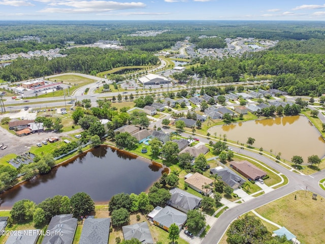 104 Twin Lakes Dr, Saint Augustine, FL 32084 - aerial perspective of suburban area featuring a heavily wooded area and a large body of water