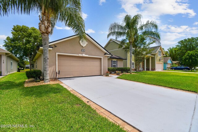 104 Twin Lakes Dr, Saint Augustine, FL 32084 - traditional-style house featuring an attached garage, driveway, stucco siding, and a front yard