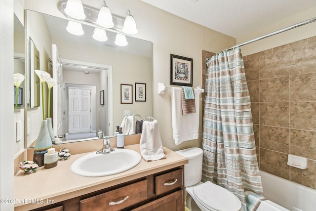 104 Twin Lakes Dr, Saint Augustine, FL 32084 - bathroom with vanity, toilet, shower / tub combo, and a textured ceiling
