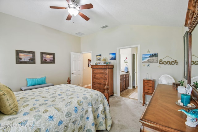 104 Twin Lakes Dr, Saint Augustine, FL 32084 - bedroom featuring vaulted ceiling, light colored carpet, ceiling fan, ensuite bathroom, and baseboards