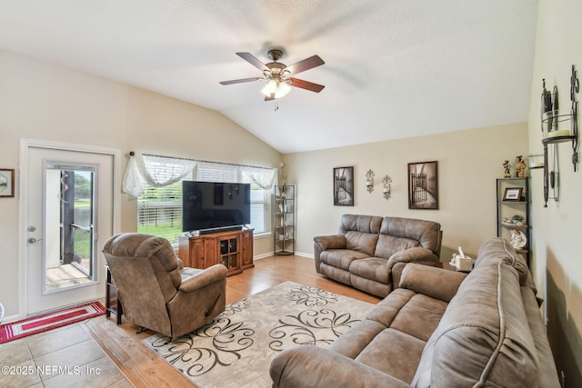 104 Twin Lakes Dr, Saint Augustine, FL 32084 - living room with lofted ceiling, a ceiling fan, light wood-style floors, and baseboards